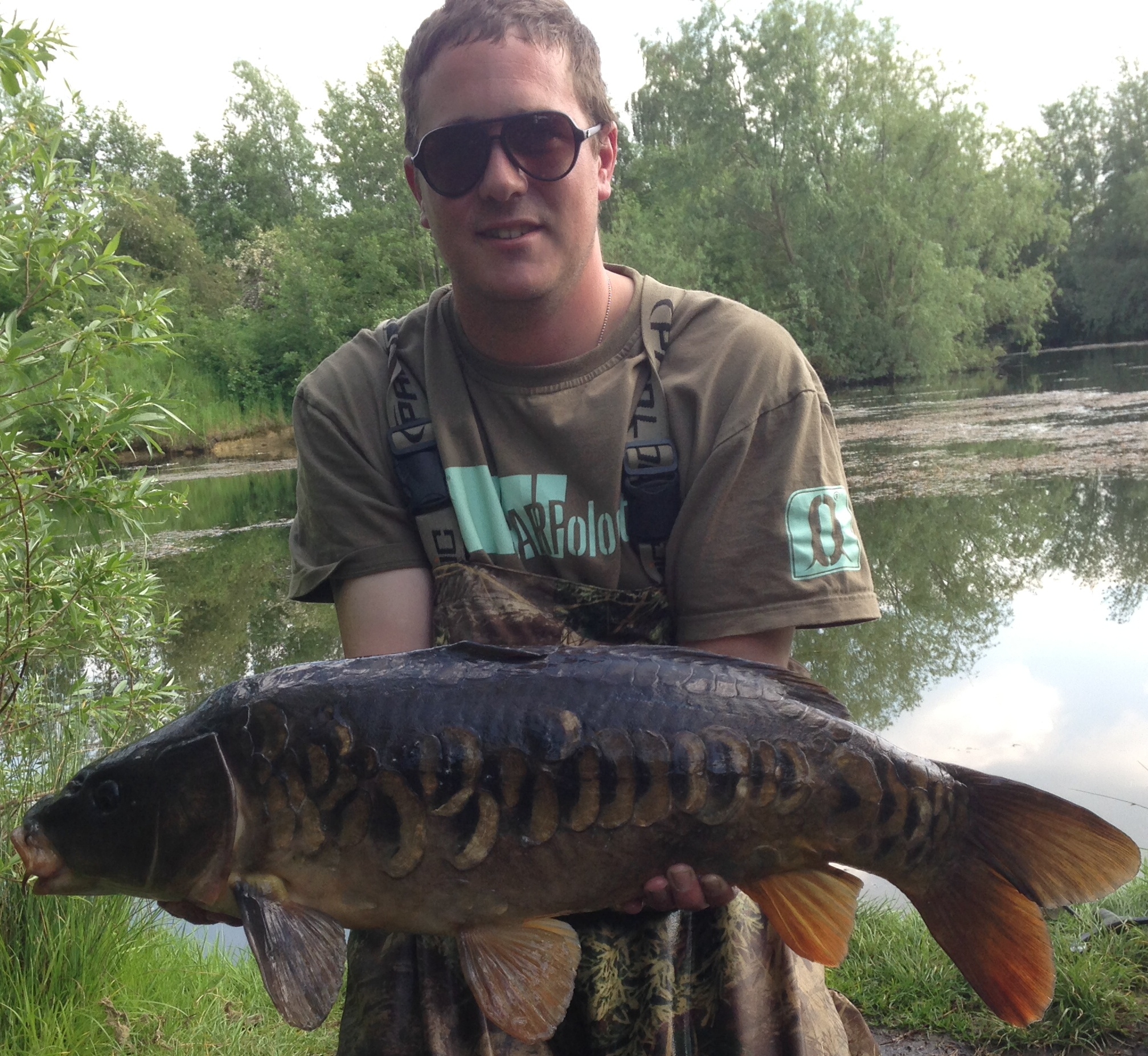 Liam Slee with a 16lb Mirror Carp caught at Heritage Lake